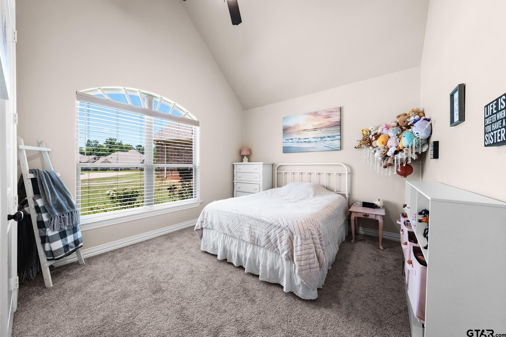 3922 Gable Crest Lane Longview, TX 75605 - Photo 30 of 36 a spacious bedroom with a bed and a large window