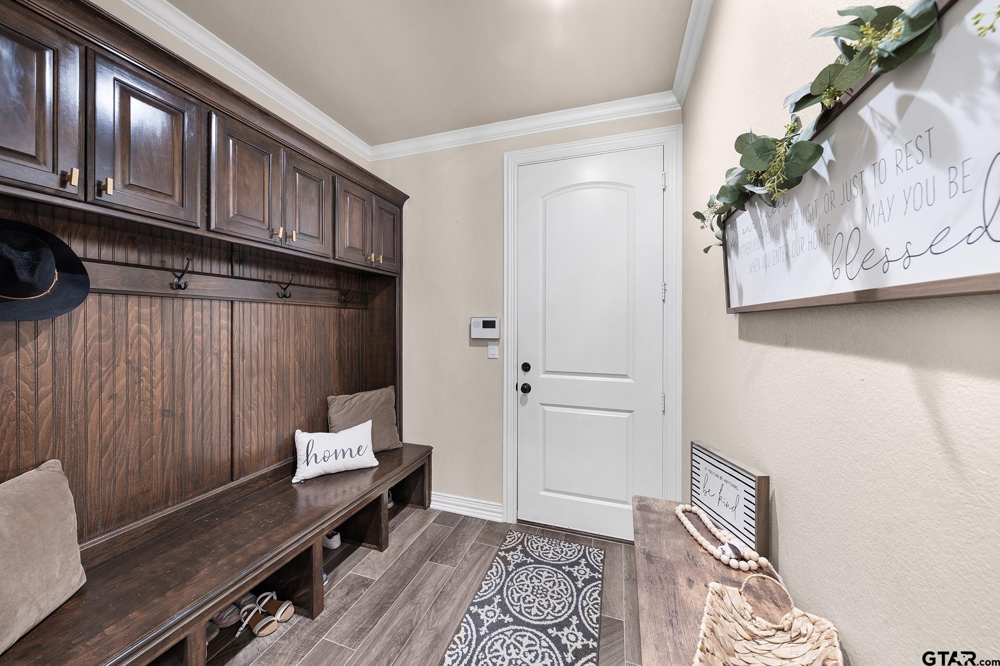 3922 Gable Crest Lane Longview, TX 75605 - Photo 35 of 36 a hallway with chairs and wooden floor