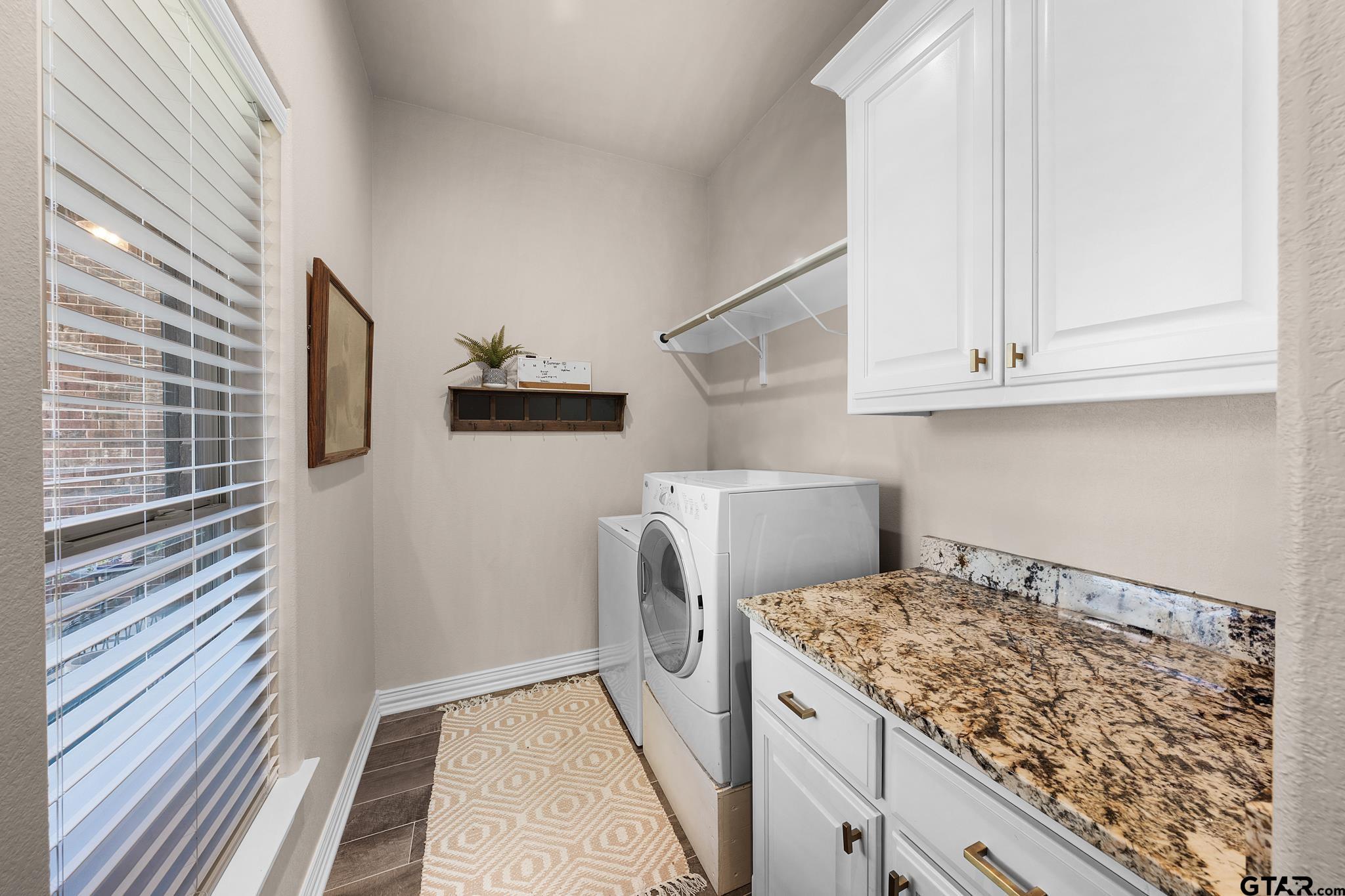 3922 Gable Crest Lane Longview, TX 75605 - Photo 36 of 36 a view of a storage and utility room with washer and dryer