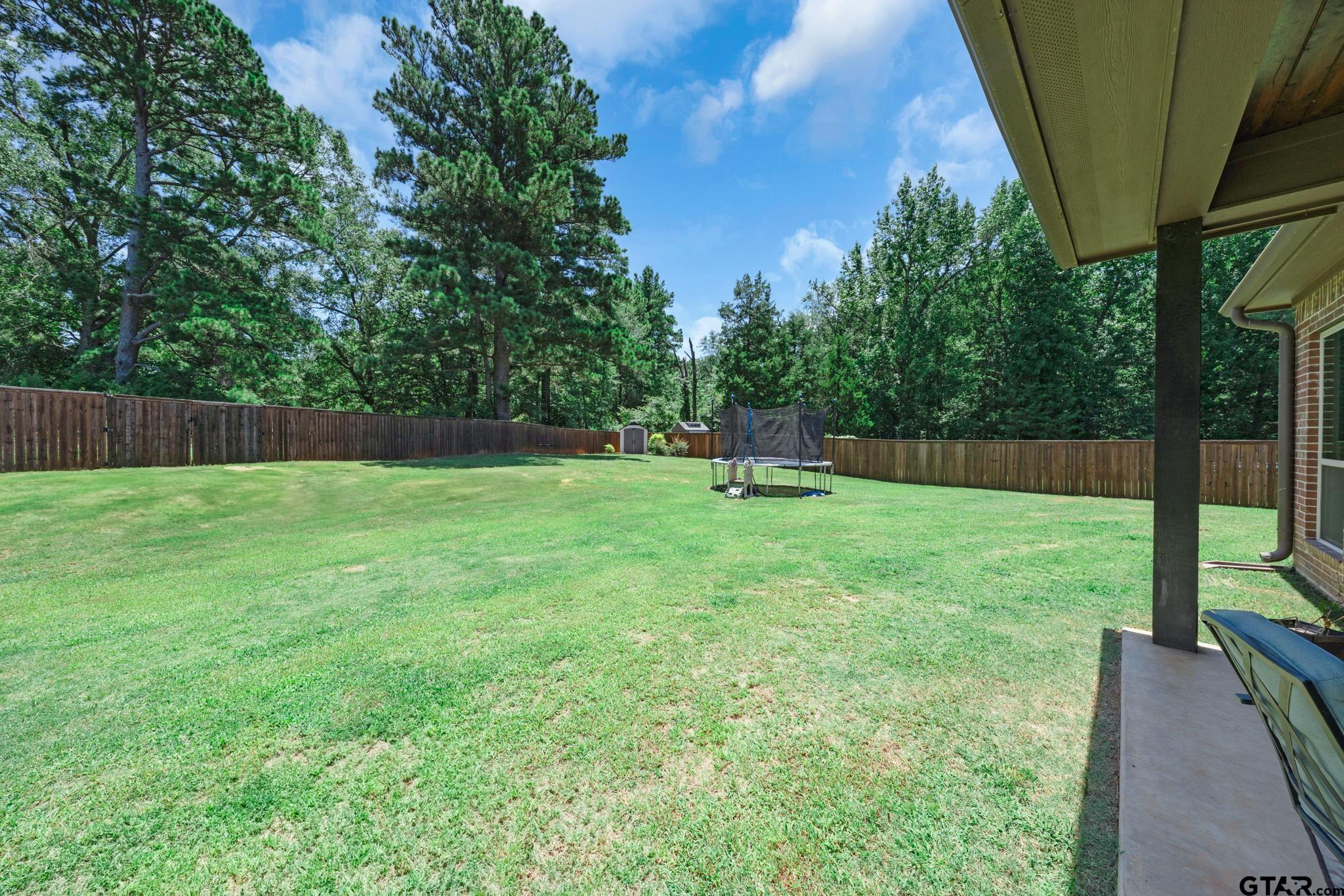3922 Gable Crest Lane Longview, TX 75605 - Photo 6 of 36 a view of outdoor space with deck and yard
