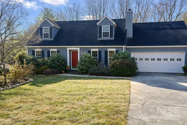 a view of house with yard