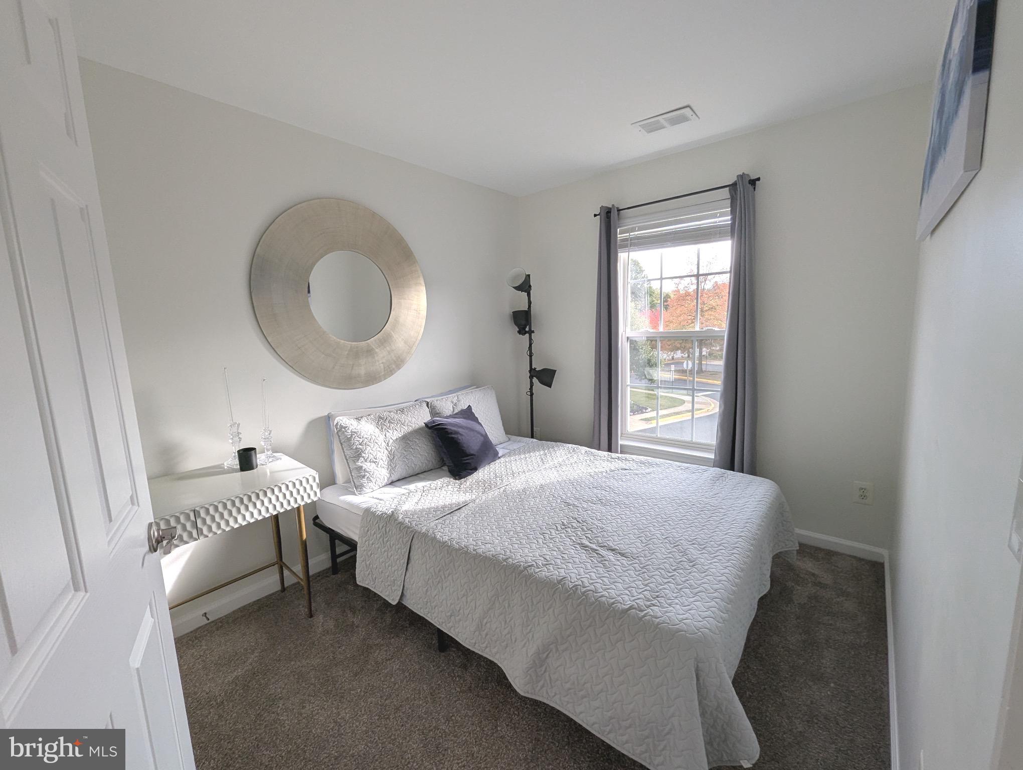 2922 Huntington Grove Square Alexandria, VA 22306 - Photo 12 of 30 a bedroom with a bed and a window