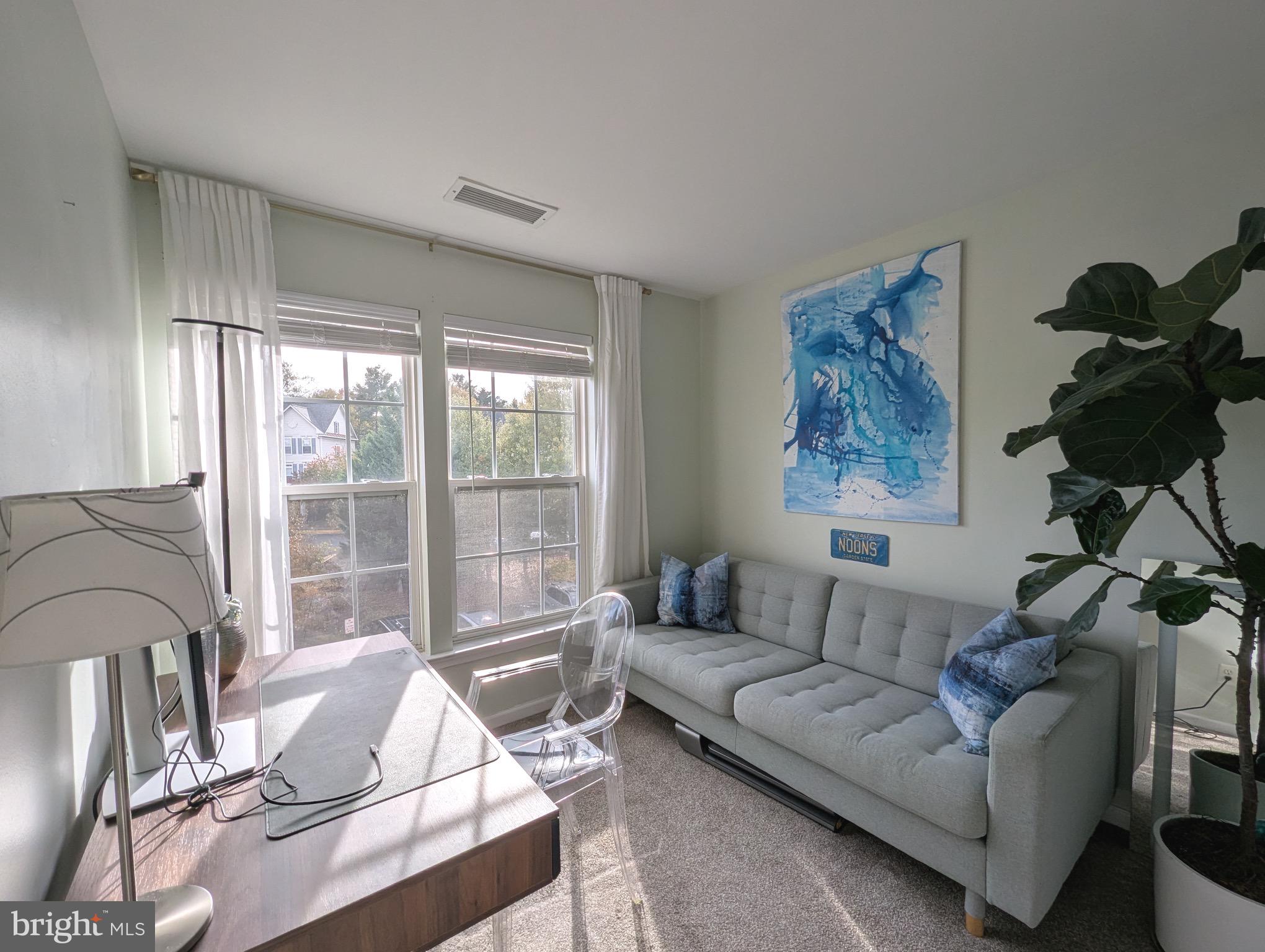 2922 Huntington Grove Square Alexandria, VA 22306 - Photo 15 of 30 a living room with furniture and a large window