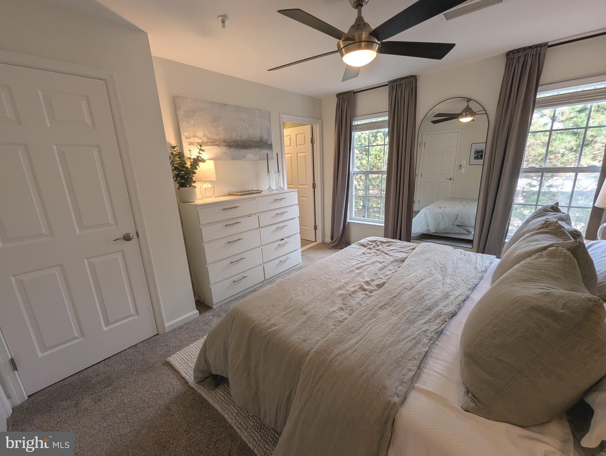 2922 Huntington Grove Square Alexandria, VA 22306 - Photo 10 of 30 a bedroom with a bed and a chandelier