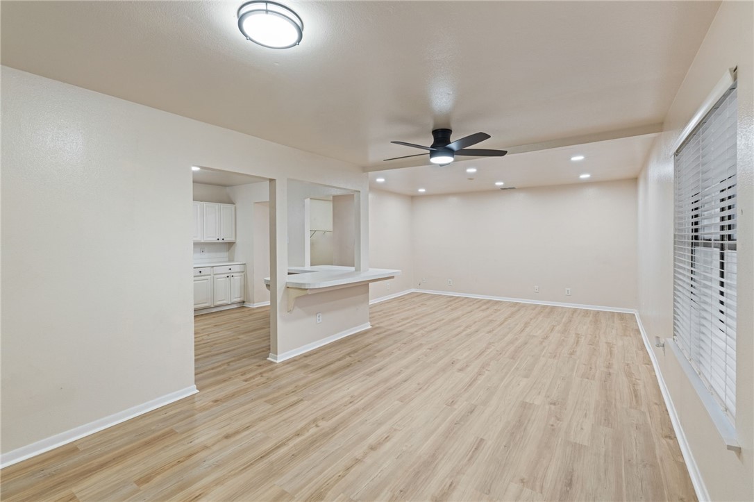 5921 Riley Drive Corpus Christi, TX 78412 - Photo 2 of 20 wooden floor in an empty room with a window
