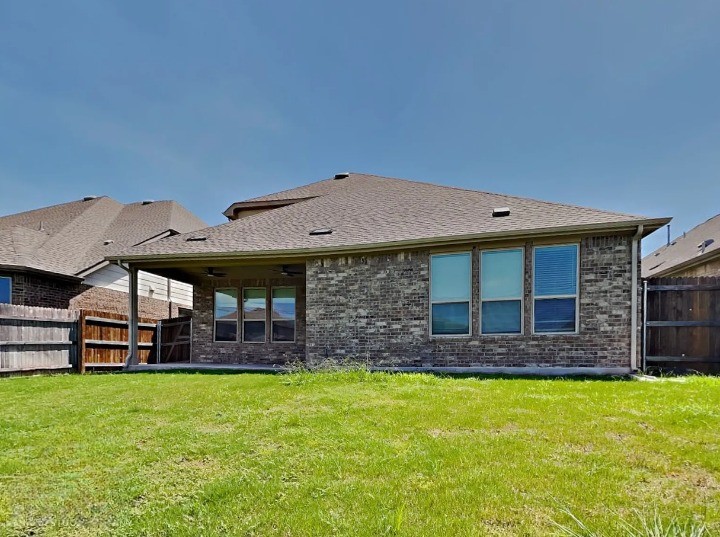 3610 Thunian Pass Pflugerville, TX 78660 - Photo 25 of 27 a view of a house with a large window and entertaining space