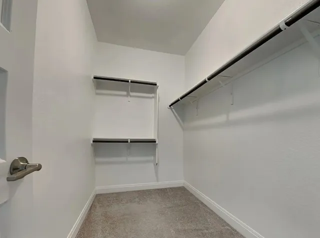 a view of an empty walk in closet