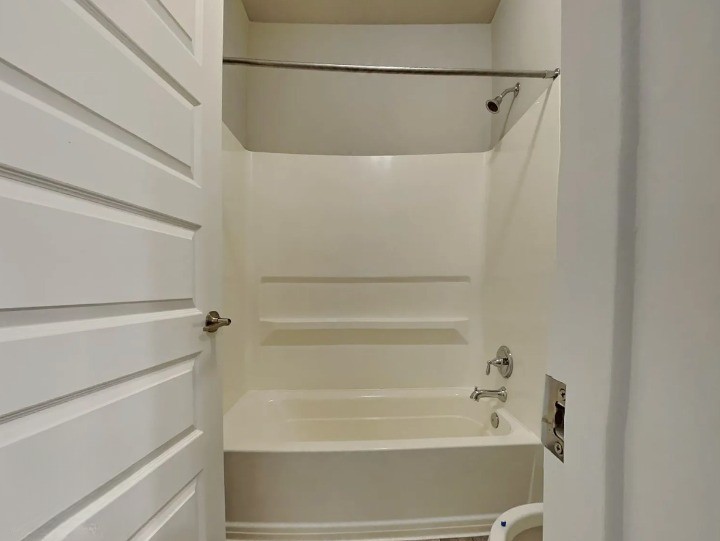 3610 Thunian Pass Pflugerville, TX 78660 - Photo 5 of 27 a bathroom with a shower and a bath tub