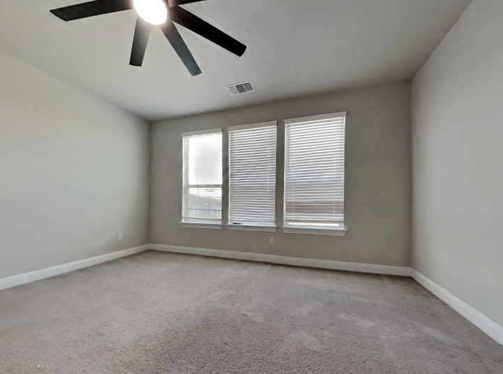 3610 Thunian Pass Pflugerville, TX 78660 - Photo 8 of 27 an empty room with a window and a ceiling fan