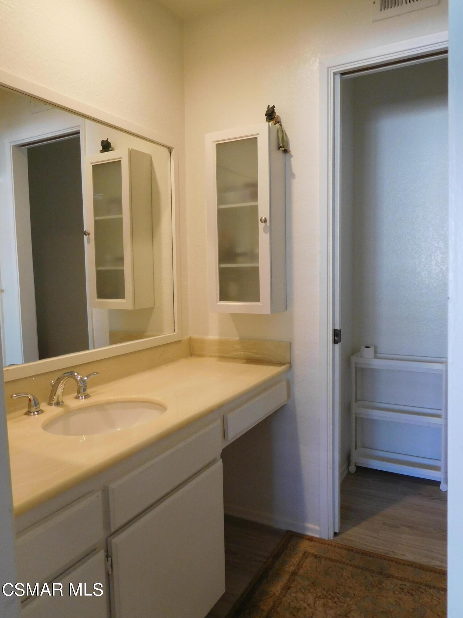 5225 Diane Street, Unit B Simi Valley, CA 93063 - Photo 17 of 24 a bathroom with a sink and a mirror