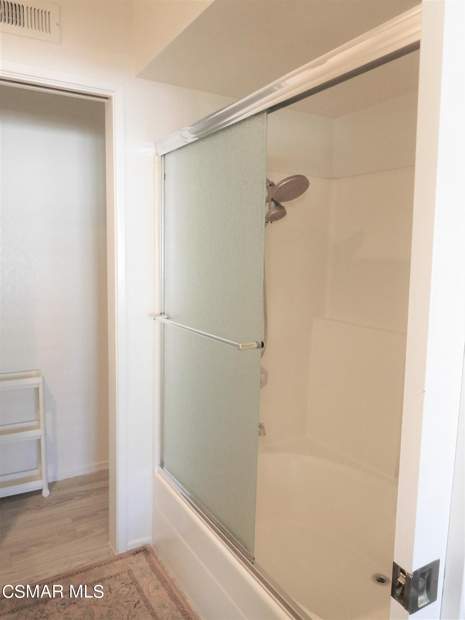 5225 Diane Street, Unit B Simi Valley, CA 93063 - Photo 18 of 24 a bathroom with a glass shower door