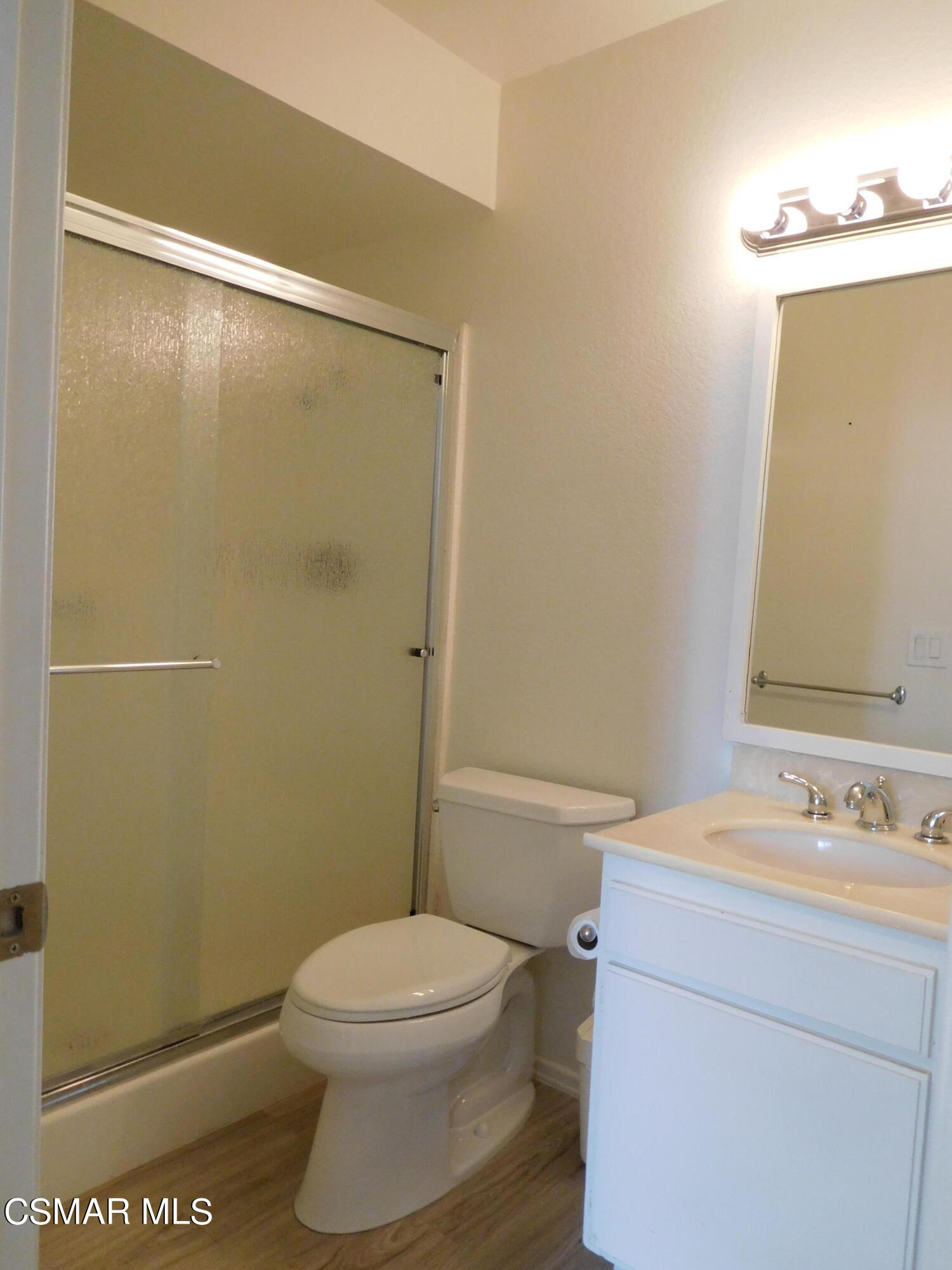 5225 Diane Street, Unit B Simi Valley, CA 93063 - Photo 20 of 24 a bathroom with a sink a toilet and shower