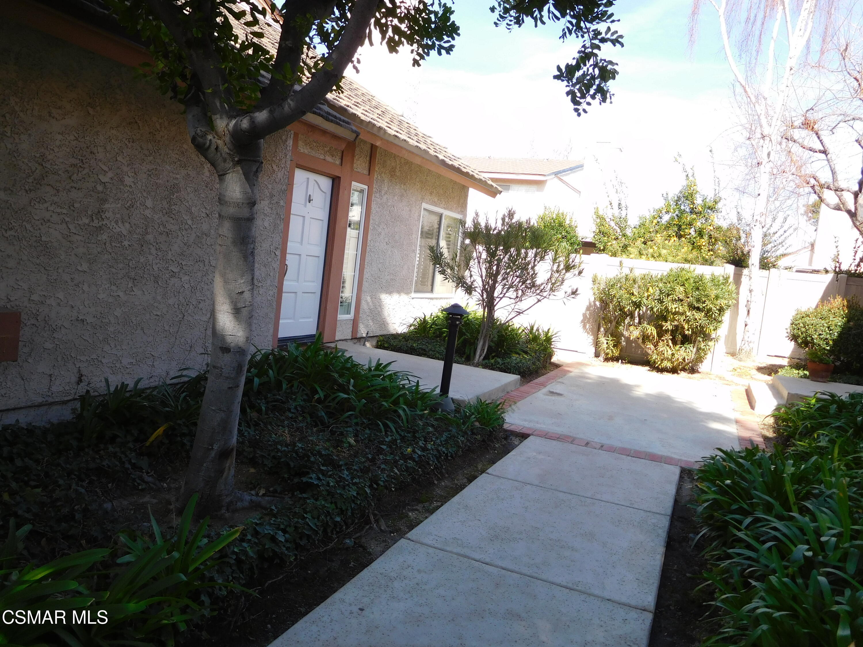 5225 Diane Street, Unit B Simi Valley, CA 93063 - Photo 4 of 24 a view of a house with a yard