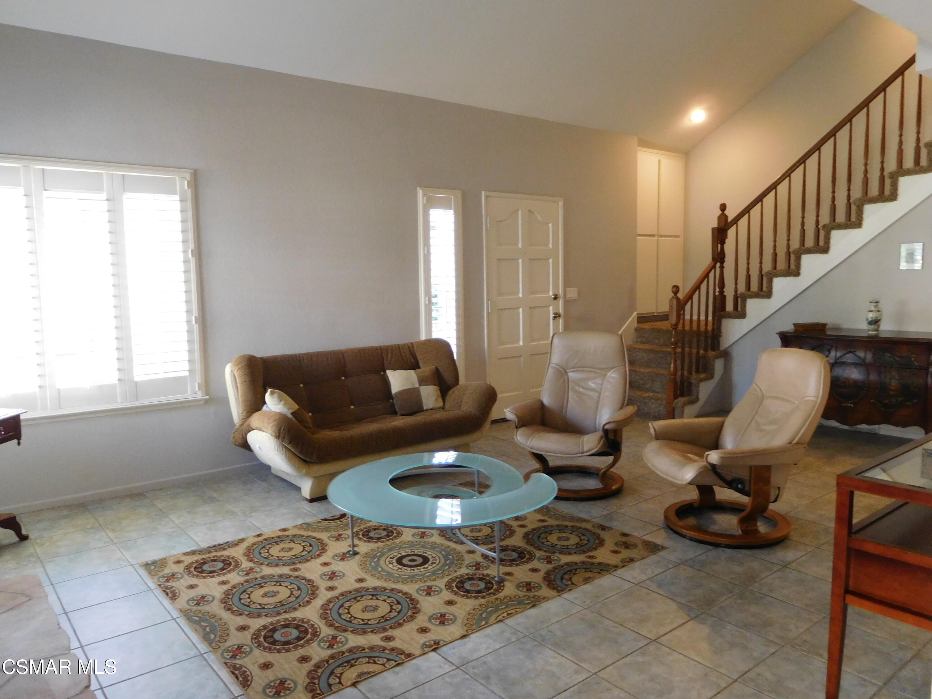 5225 Diane Street, Unit B Simi Valley, CA 93063 - Photo 8 of 24 a living room with furniture and a rug