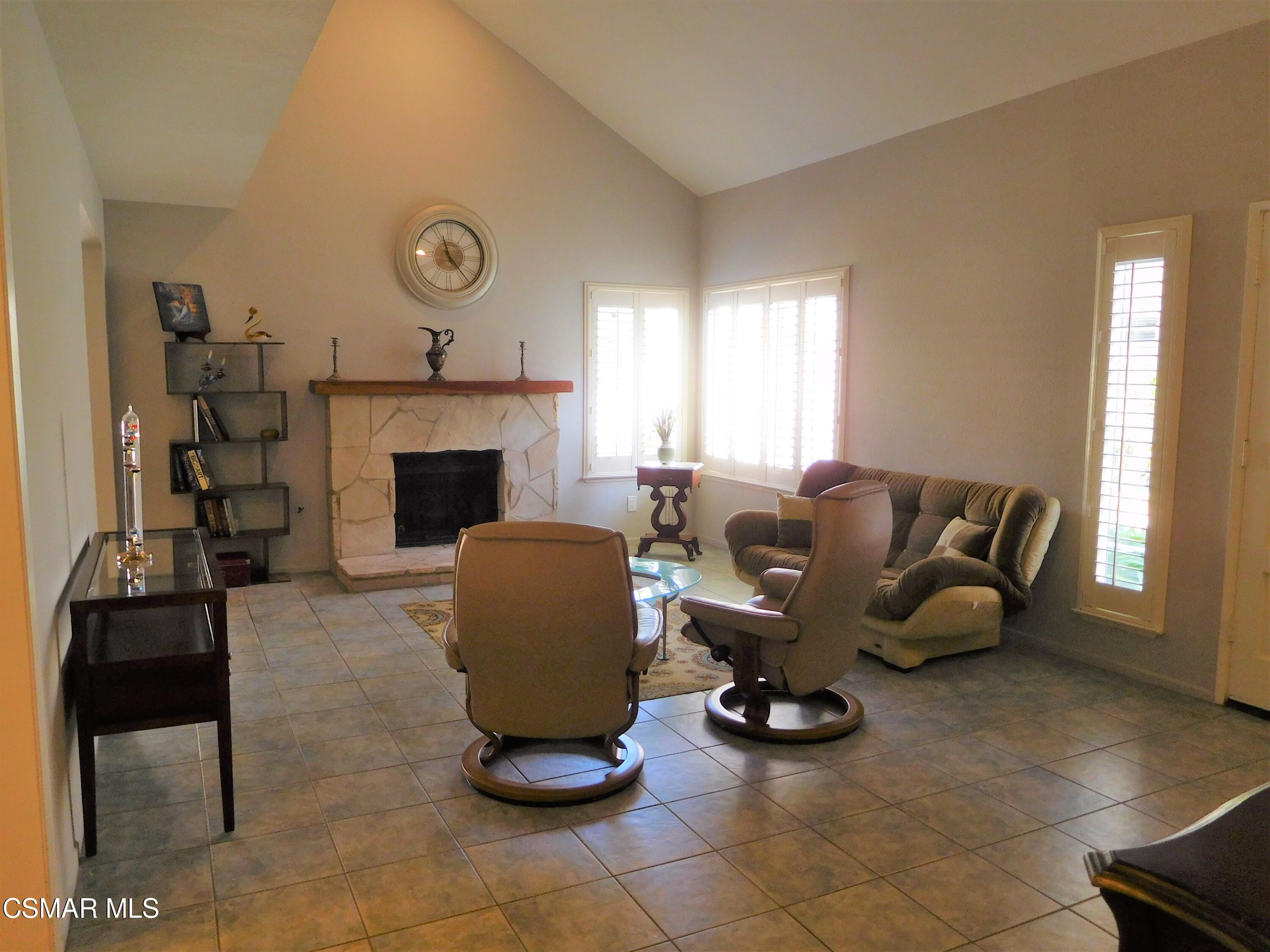 5225 Diane Street, Unit B Simi Valley, CA 93063 - Photo 9 of 24 a living room with furniture and a fireplace