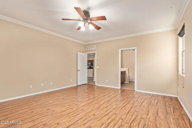 a view of a room with a ceiling fan