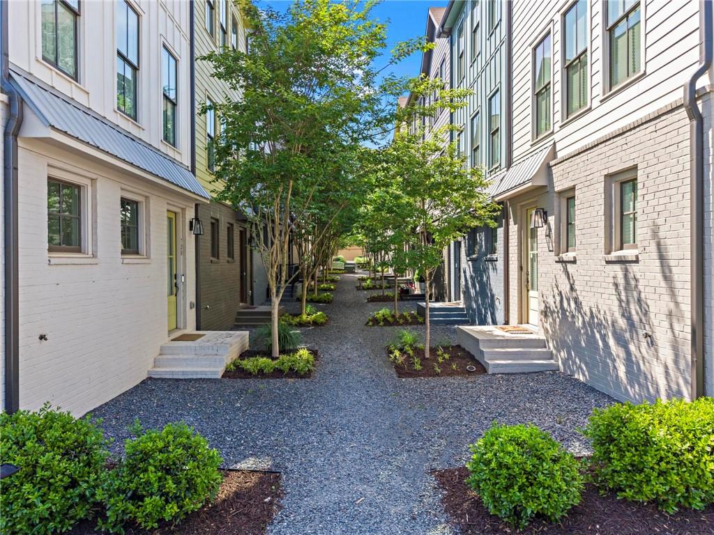 718 Needletail Way Atlanta, GA 30312 - Photo 34 of 44 a view of a building with potted plants and flower plants