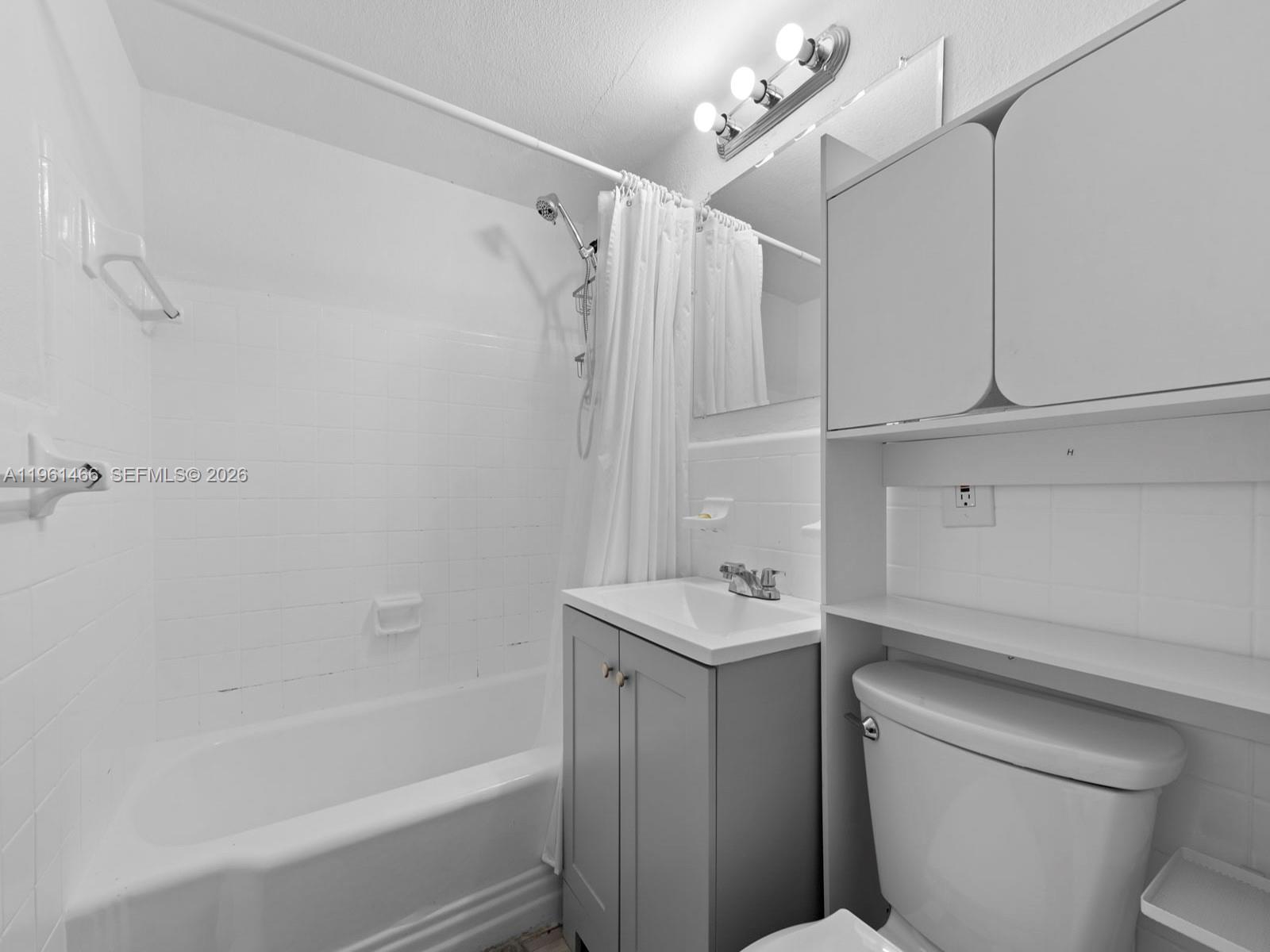 4444 Southwest 67th Avenue, Unit 7 Miami, FL 33155 - Photo 14 of 28 a bathroom with a sink a toilet and shower