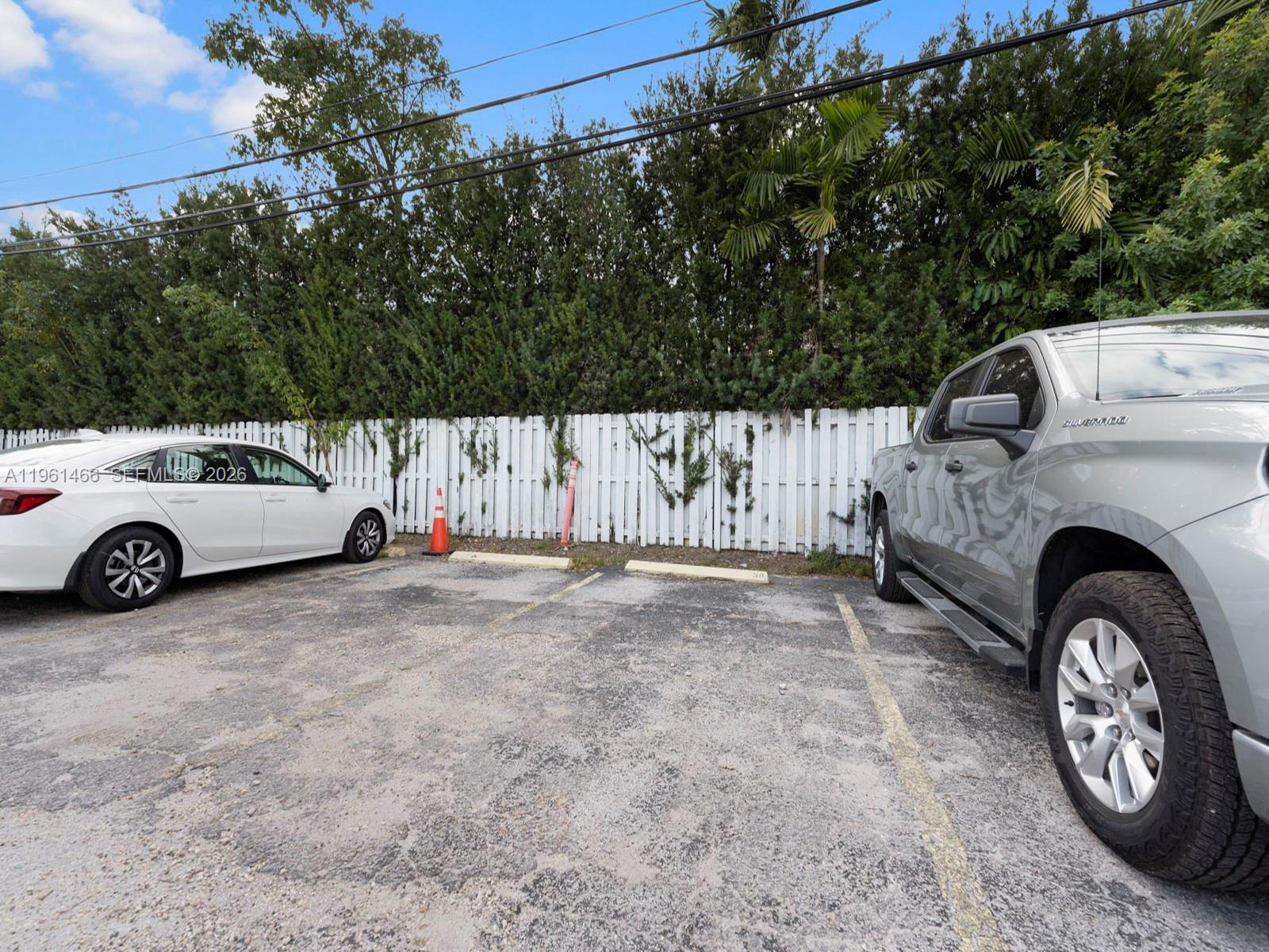 4444 Southwest 67th Avenue, Unit 7 Miami, FL 33155 - Photo 15 of 28 a view of a cars parked in a parking area