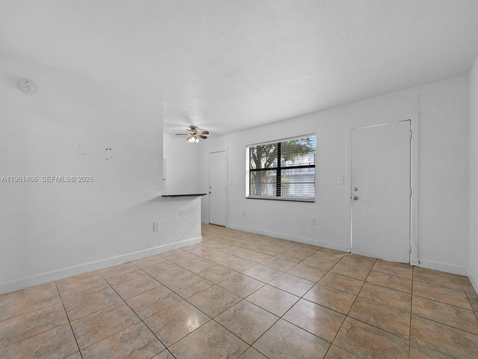 4444 Southwest 67th Avenue, Unit 7 Miami, FL 33155 - Photo 2 of 28 an empty room with windows