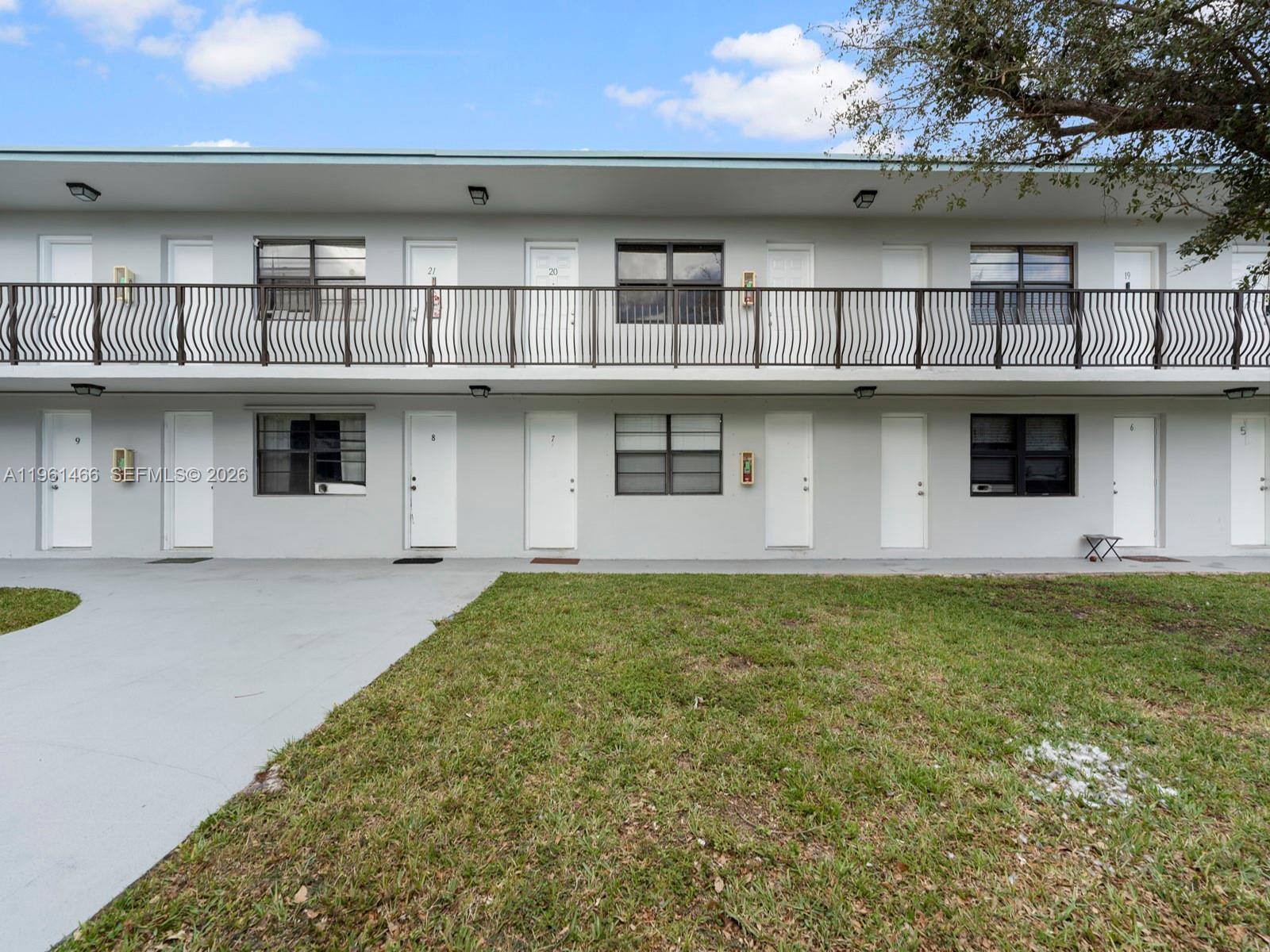 4444 Southwest 67th Avenue, Unit 7 Miami, FL 33155 - Photo 21 of 28 a front view of a house with a garden