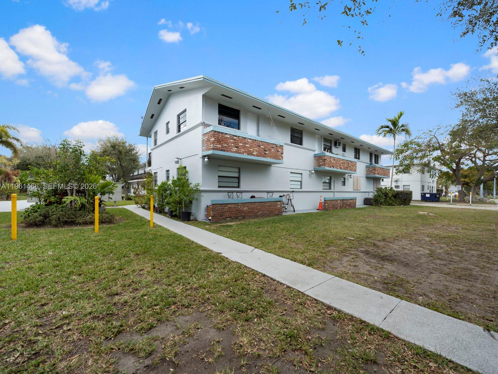 4444 Southwest 67th Avenue, Unit 7 Miami, FL 33155 - Photo 22 of 28 a front view of a house with a yard
