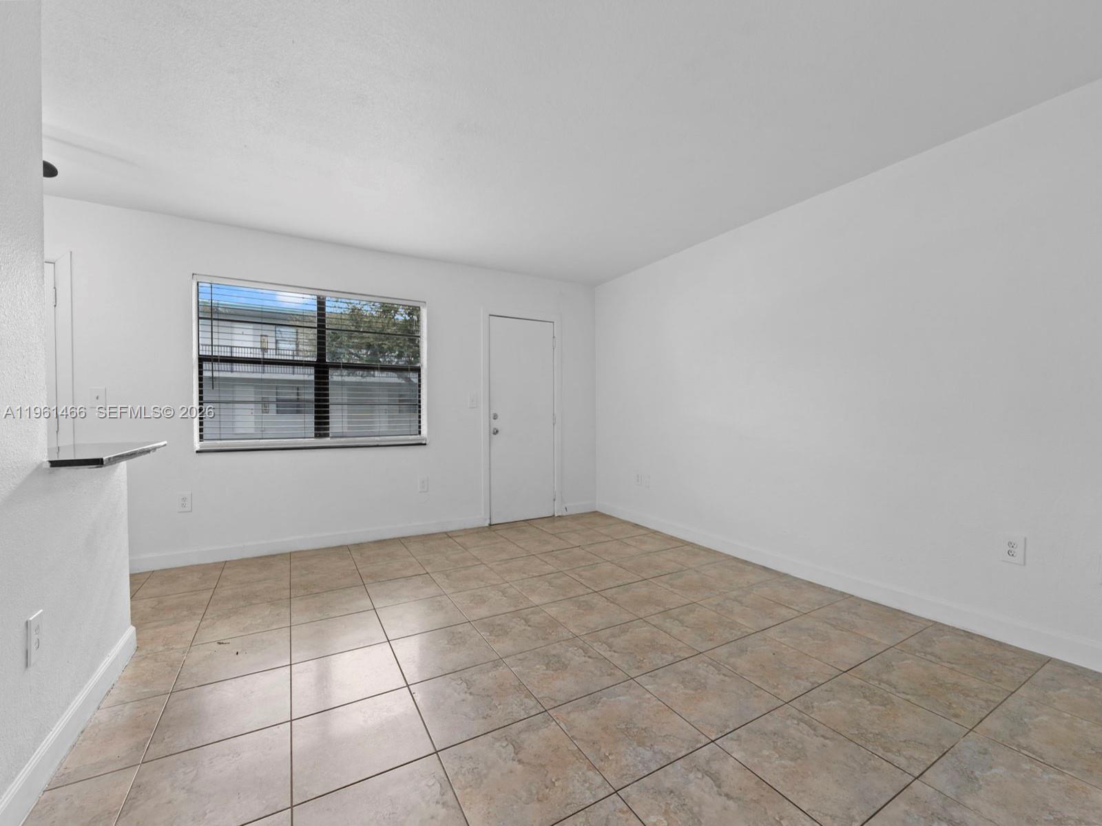 4444 Southwest 67th Avenue, Unit 7 Miami, FL 33155 - Photo 3 of 28 an empty room with windows