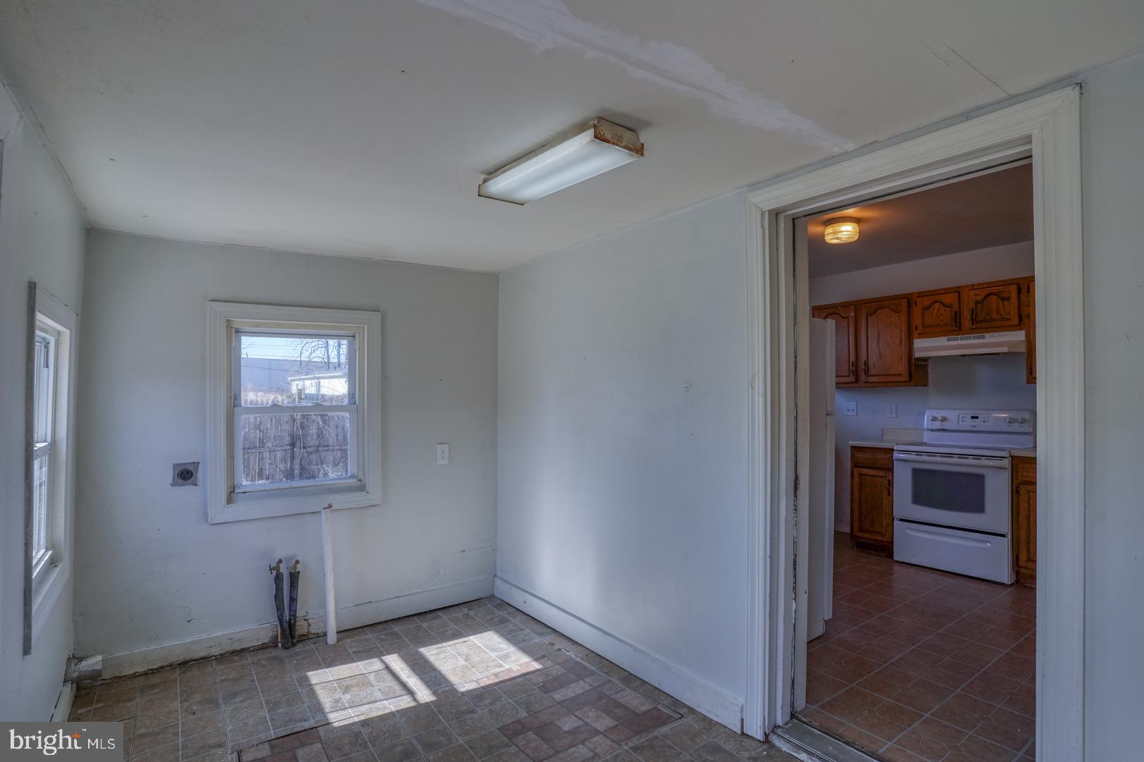 27768 Possum Point Road Millsboro, DE 19966 - Photo 23 of 25 Mudroom/laundry room leading to kitchen