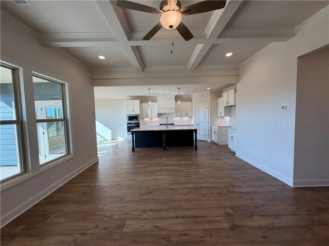 a kitchen with stainless steel appliances sink refrigerator and cabinets