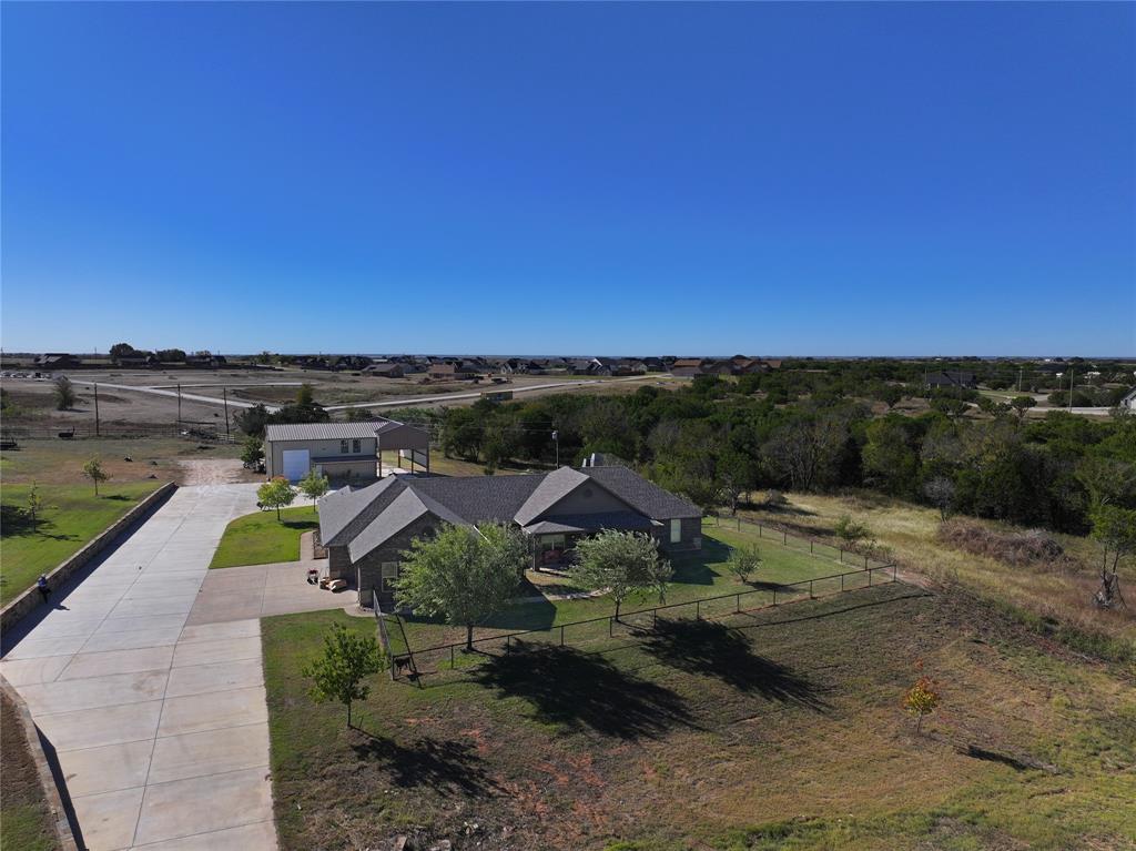 an aerial view of a house with a garden