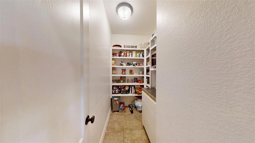 1431 Cheyenne Trail Nemo, TX 76070 - Photo 12 of 37 a view of walk in closet with clothes and shoes