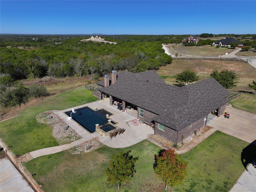 1431 Cheyenne Trail Nemo, TX 76070 - Photo 2 of 37 an aerial view of a house with a garden
