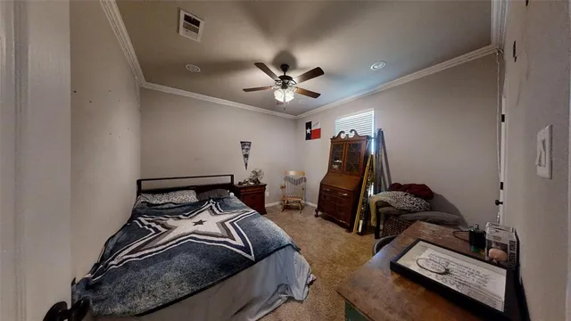 a bedroom with bed and a chandelier