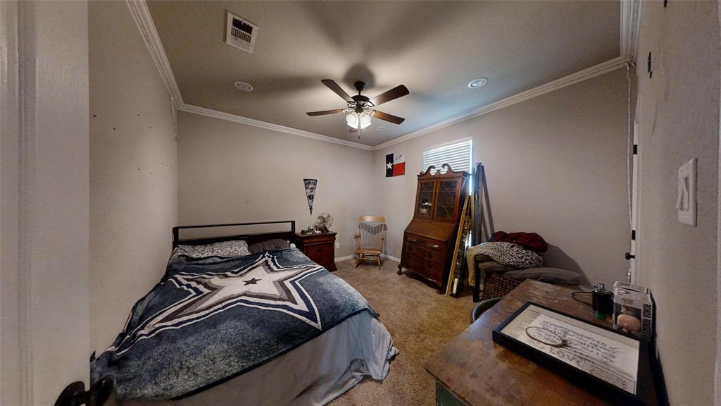 1431 Cheyenne Trail Nemo, TX 76070 - Photo 21 of 37 a bedroom with bed and a chandelier