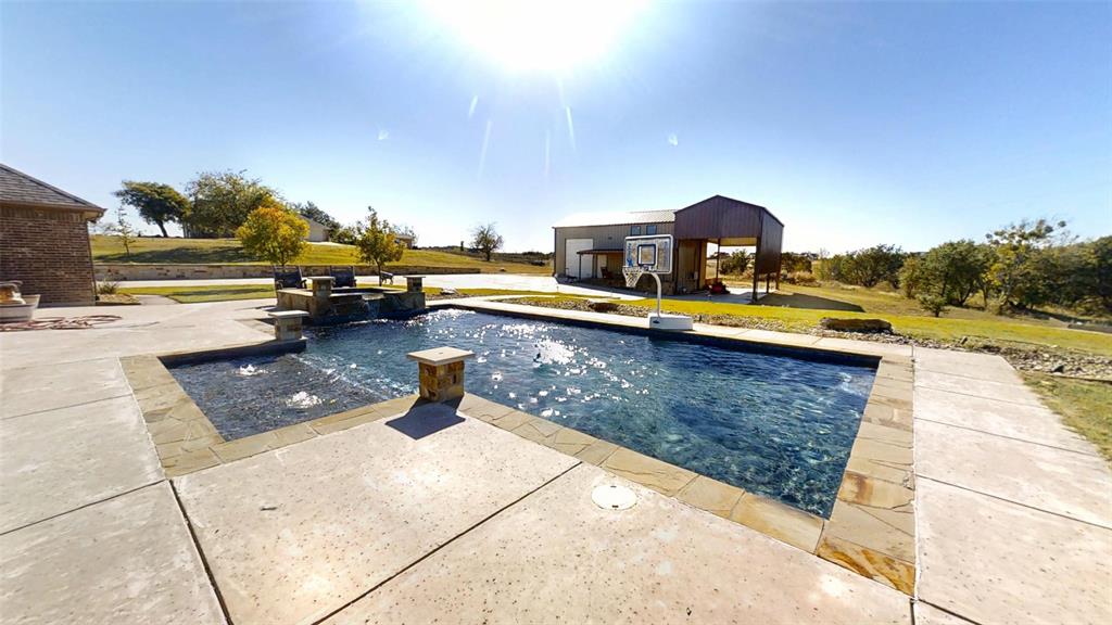 1431 Cheyenne Trail Nemo, TX 76070 - Photo 26 of 37 a view of a swimming pool with a lounge chairs