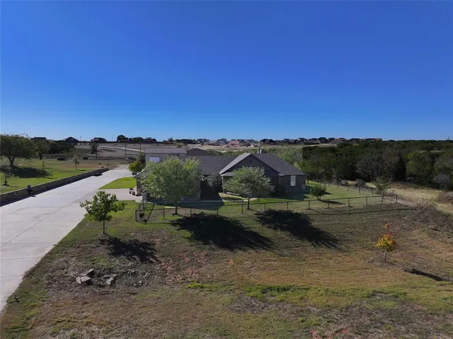 a view of a lake with green field