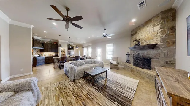a living room with furniture and a fireplace