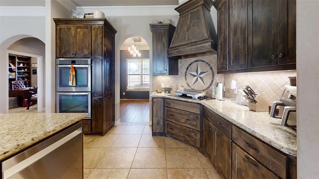 1431 Cheyenne Trail Nemo, TX 76070 - Photo 10 of 37 a kitchen with stainless steel appliances granite countertop a sink and a refrigerator