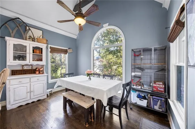 a view of a dining room with furniture window and wooden floor