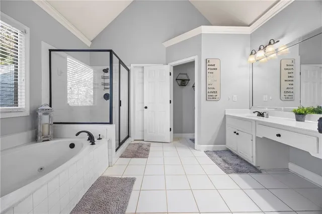 a en suite bathroom with a toilet a sink and mirror