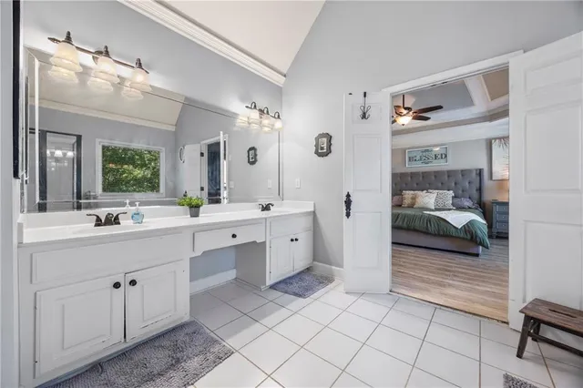 a view of a hallway with windows and stairs