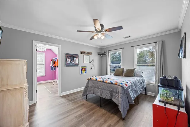 a bedroom with furniture and a window