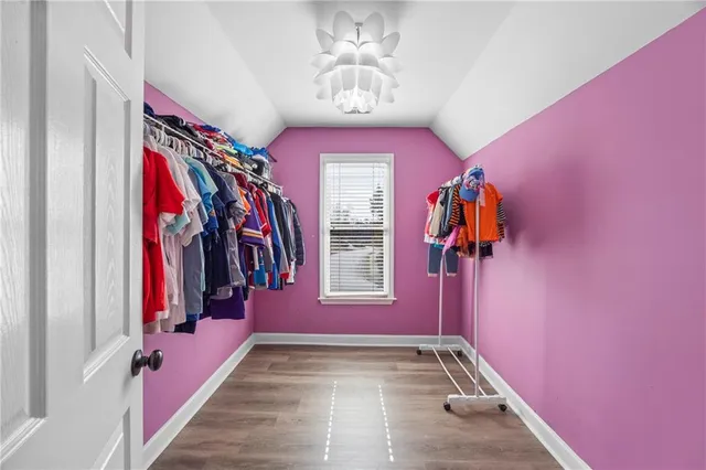 a spacious en suite bathroom with a double vanity sink and a mirror