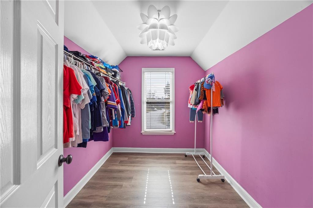 3420 Millwater Crossing Northeast Dacula, GA 30019 - Photo 28 of 54 a view of a hallway with windows and stairs