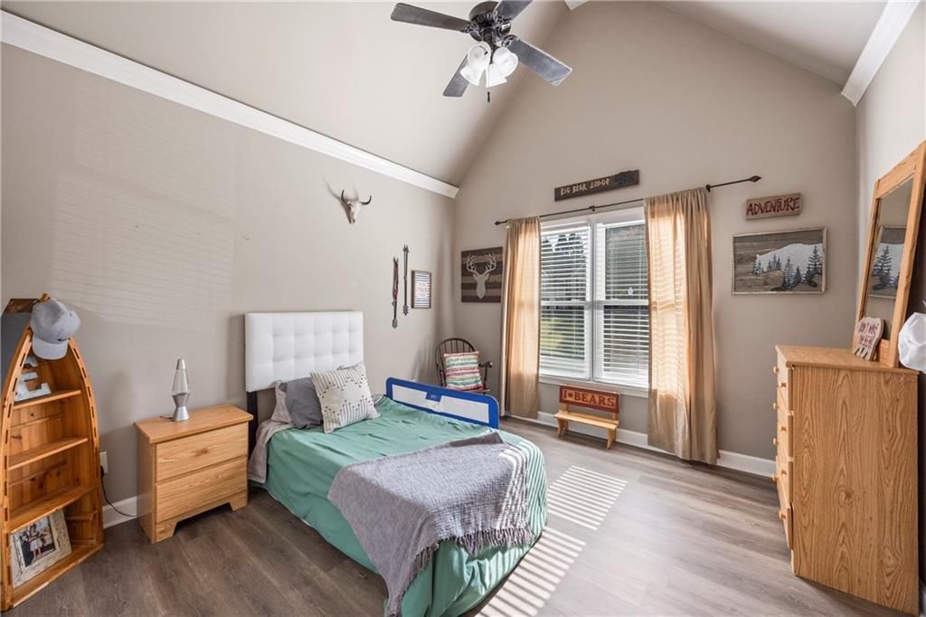 3420 Millwater Crossing Northeast Dacula, GA 30019 - Photo 29 of 54 a bedroom with furniture and a window