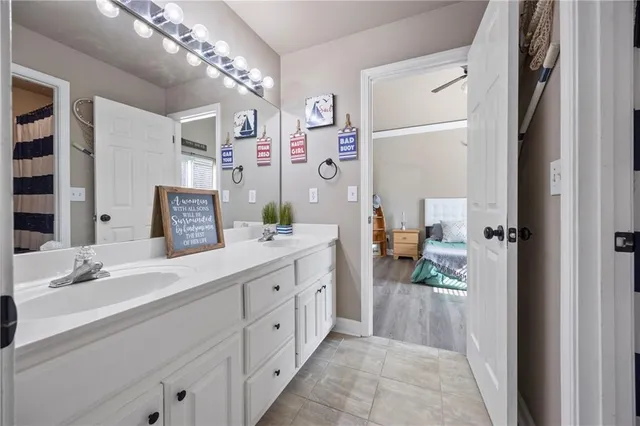 a bedroom with furniture and a wooden floor
