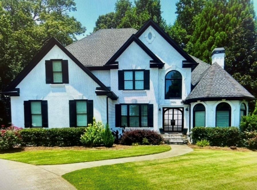 3420 Millwater Crossing Northeast Dacula, GA 30019 - Photo 3 of 54 a front view of a house with a yard