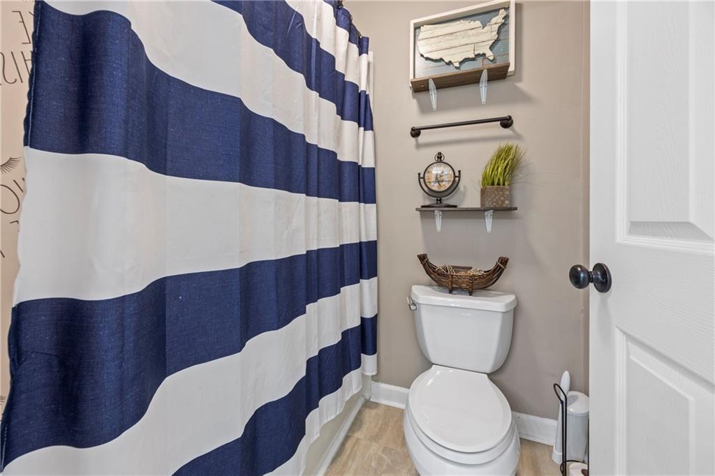 3420 Millwater Crossing Northeast Dacula, GA 30019 - Photo 31 of 54 a bathroom with a toilet and a mirror
