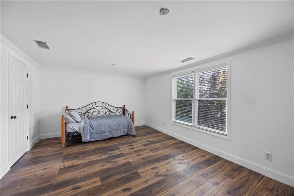 3420 Millwater Crossing Northeast Dacula, GA 30019 - Photo 33 of 54 a room with a bed and a window