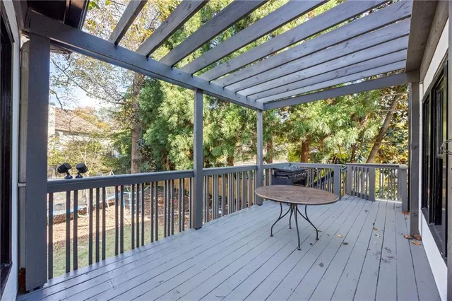 a view of a yard with plants and trees